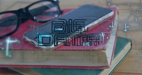 Smartphone resting on books with big data circuit overlay for digital learning and research
