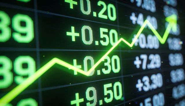 Neon green stock market trend line rising on led ticker showing positive gains for traders