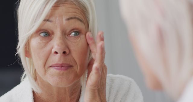 Suitable for advertisements and articles about skincare and beauty routines for older women, promoting anti-aging products, or discussing health and wellness for seniors.