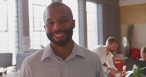 Smiling Creative Professional in Modern Office Setting