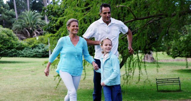 Happy Family Enjoying Time Together in Park on Sunny Day - Download Free Stock Images Pikwizard.com