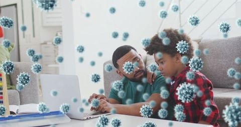 Father and son exploring technology with virus overlay