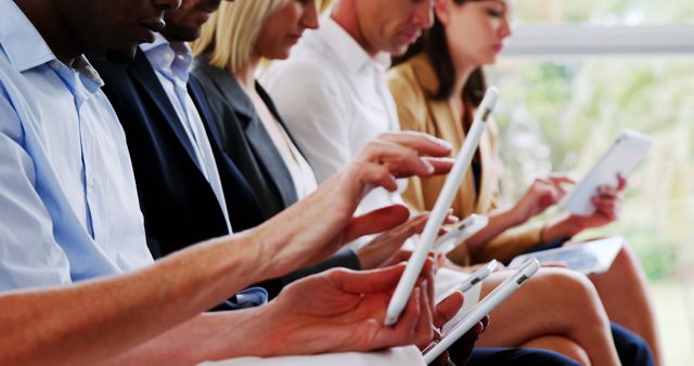 Diverse Team Focusing on Mobile Devices during Business Meeting - Download Free Stock Images Pikwizard.com