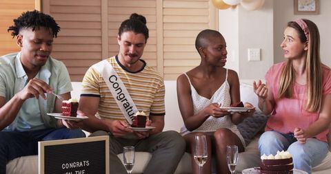 Friends Celebrating with Cake and Laughter at Home Gathering
