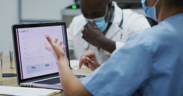 Healthcare professionals analyzing medical data on laptop - Download Free Stock Images Pikwizard.com