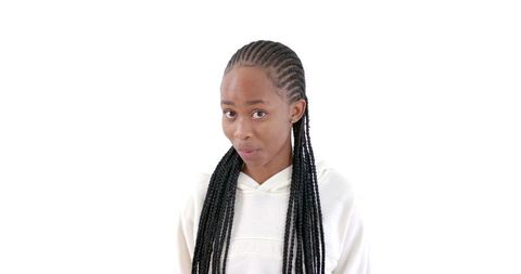 Young Woman with Braids in White Hoodie Expressing Curiosity