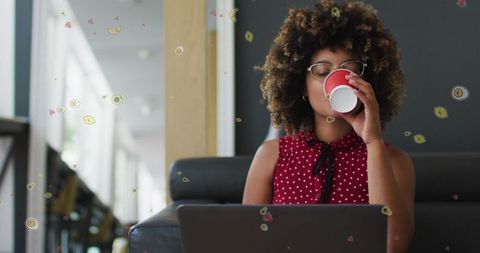 Young woman sip coffee while working from cozy home interior