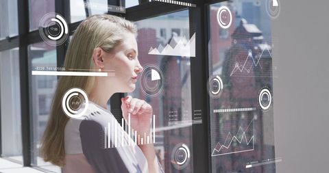 Businesswoman Analyzing Digital Data with Futuristic Interface