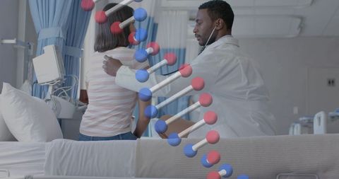 Doctor examining patient at bedside with dna helix overlay representing medical genetics