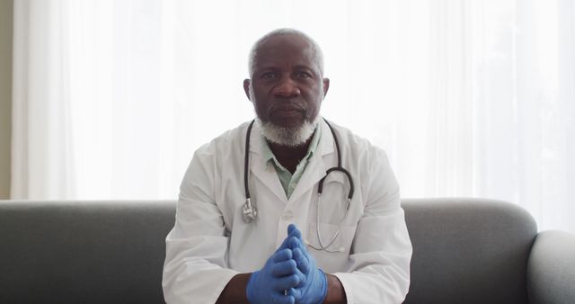 Experienced Senior Doctor Wearing Lab Coat and Gloves - Download Free Stock Images Pikwizard.com