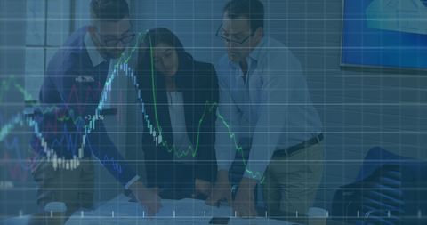 Finance experts analyzing graphs in office for market trends