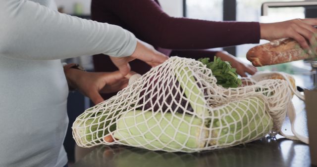 Two People Unpacking Fresh Vegetables and Baguette in Eco-friendly Bag - Download Free Stock Images Pikwizard.com