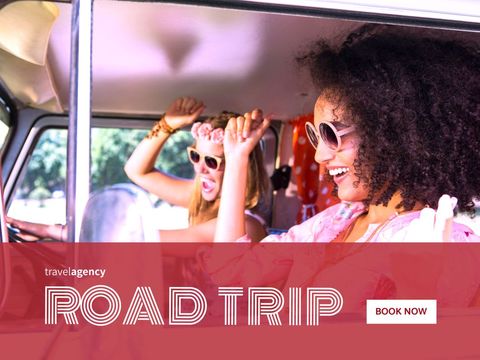Excited friends enjoying a fun road trip in vintage camper van