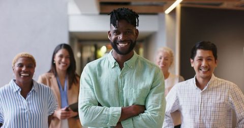 Diverse Professionals Smiling in Modern Office Hallway