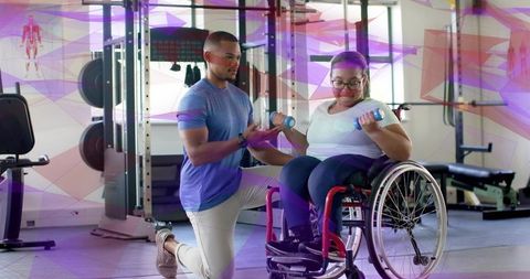 Trainer guiding woman in wheelchair performing dumbbell curls at gym, adaptive strength session