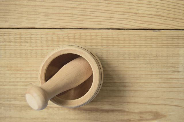 Wooden Mortar and Pestle on Light Wood Surface - Download Free Stock Images Pikwizard.com