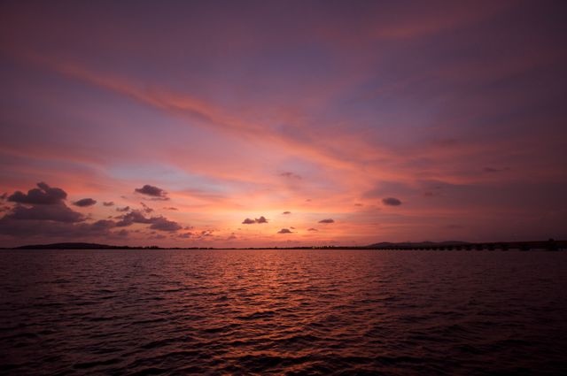 Tranquil Sunset Over Calm Ocean with Colorful Sky - Download Free Stock Photos Pikwizard.com