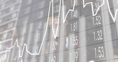 Chinese businesswoman peering through glass financial dashboard overlay analyzing data