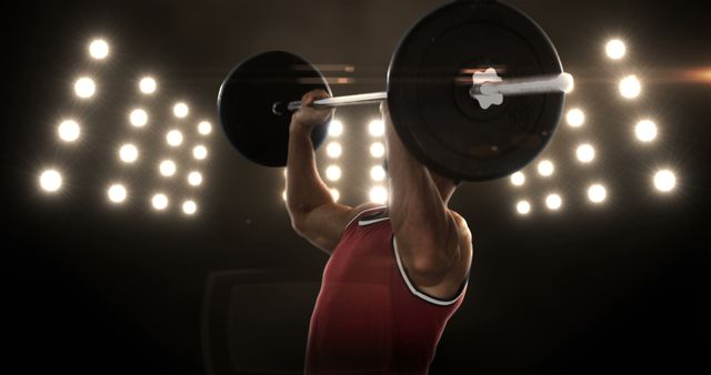 Male Weightlifter Lifting Barbell During Competition with Spotlights - Download Free Stock Images Pikwizard.com