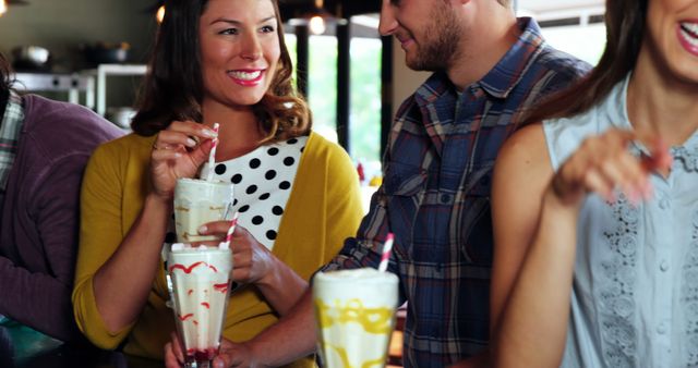 Group of Friends Enjoying Milkshakes in Cafe - Download Free Stock Images Pikwizard.com