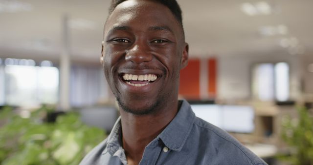 Smiling African American Man in Modern Office Environment - Download Free Stock Images Pikwizard.com