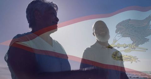 Smiling Senior Couple Sharing Sunset Stroll on Tranquil Beach