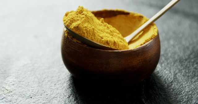 Close-up of Curcumin Turmeric Powder in Wooden Bowl with Spoon - Download Free Stock Images Pikwizard.com