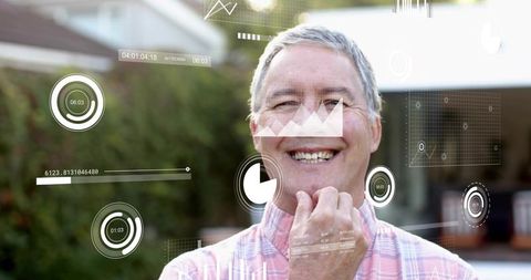 Smiling senior man wearing pink checkered shirt displaying augmented reality data overlays