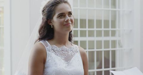 Bride in Elegant White Dress Radiates Happiness at Ceremony