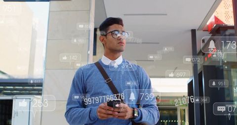 Young professional checking smartphone with social notification overlays in urban lobby
