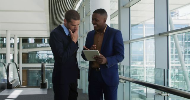 Business Professionals Discussing Over Tablet in Modern Office Building - Download Free Stock Images Pikwizard.com