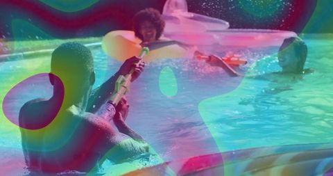 Joyful summer pool party with water gun fun