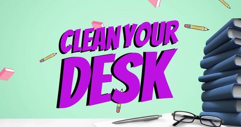 Motivational message to clean desk with books and stationery