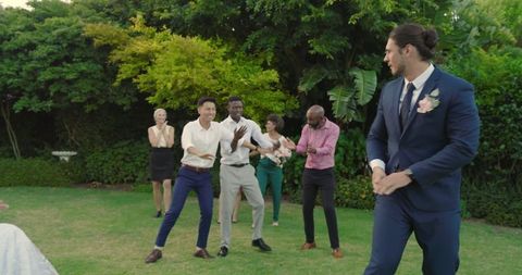 Guests Joyfully Dancing at Outdoor Wedding Celebration