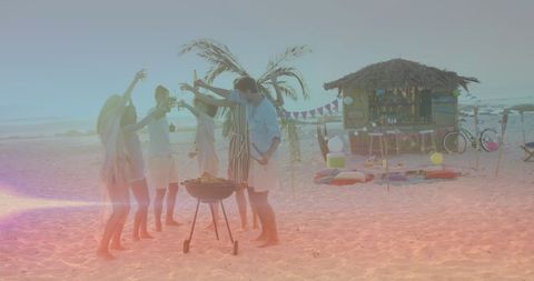 Friends Celebrating Beach BBQ Under Sunset