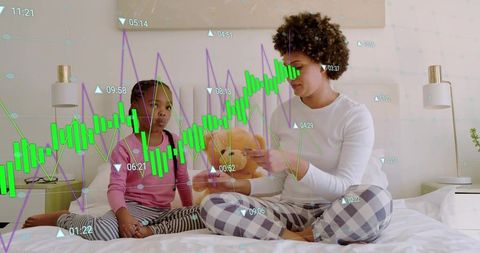 Mother and daughter sharing teddy on bed with digital data overlay representing family budgeting