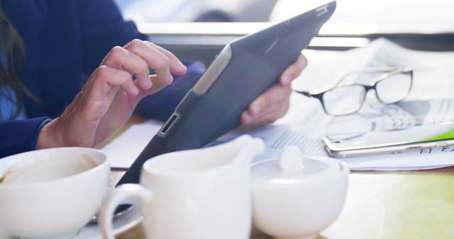 Closeup of Person Using Tablet in Coffee Shop - Download Free Stock Images Pikwizard.com