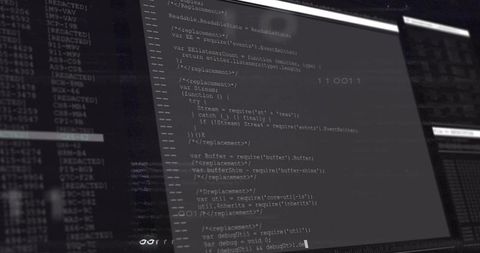 Software Developer Working with JavaScript on Dual Monitors