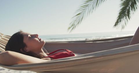 Young Woman Relaxing in Hammock on Peaceful Beach - Download Free Stock Images Pikwizard.com