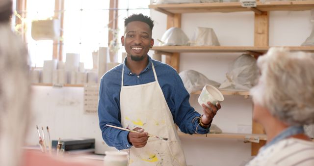 African American Man Instructing in Pottery Class - Download Free Stock Images Pikwizard.com