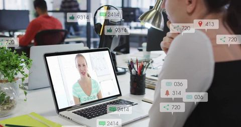 Remote Team Collaborating on Video Call with Social Notifications Overlay in Modern Office