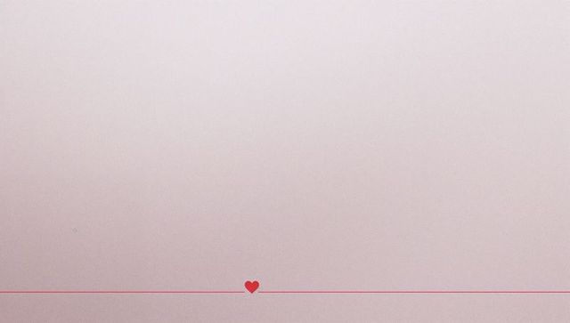 Minimalist red heart balancing on thin red line over pale pink gradient for stationery