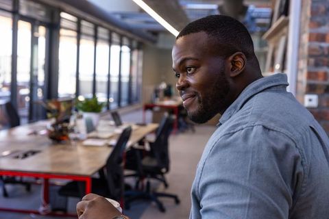 Professional using coffee break in modern office