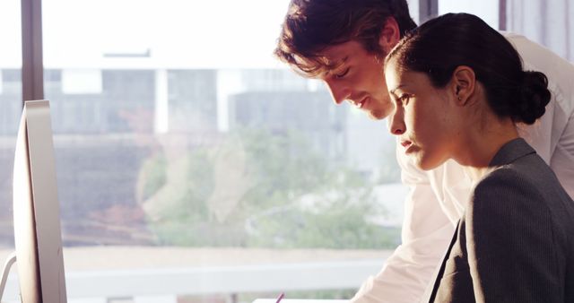 Two Professionals Collaborating at Office Desk - Download Free Stock Images Pikwizard.com