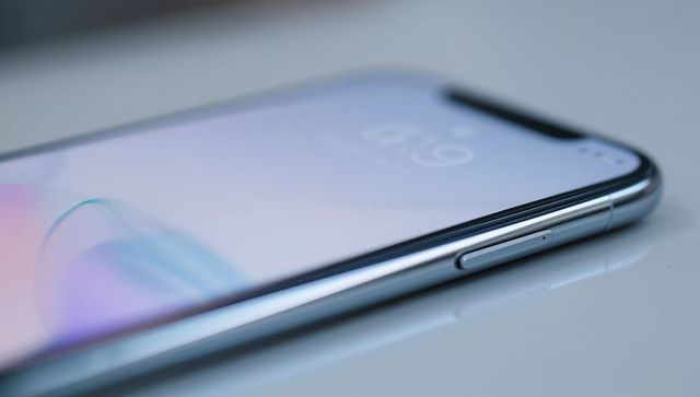 Minimalist smartphone profile showcasing chrome edge, notch display and pastel gradient