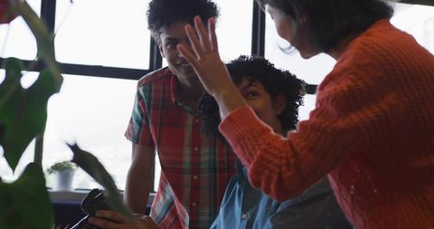 Creative team collaboration in modern office with dslr camera