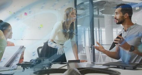 Woman leading drone development team in collaborative office, planning design and testing
