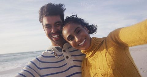 Joyful Couple Taking Selfie on Beach Vacation