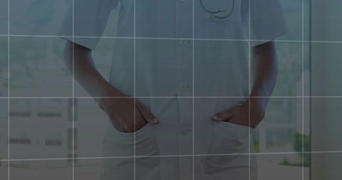 Healthcare Professional in Modern Clinical Attire Standing Indoors