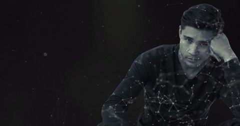 Pensive Man Surrounded by Futuristic Digital Networks